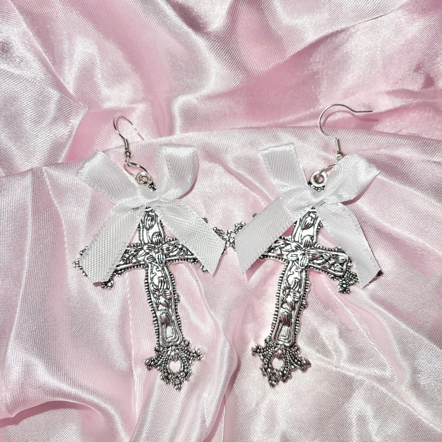 Bow cross earrings