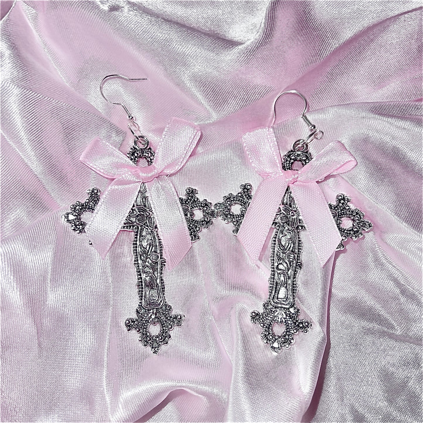 Bow cross earrings